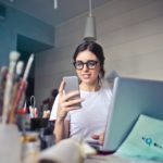 lady at desk with phone