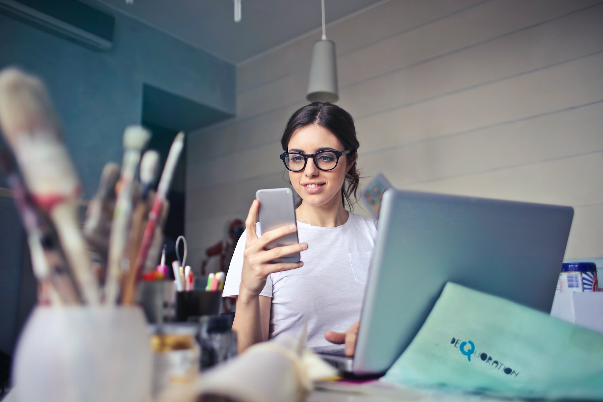 lady at desk with phone